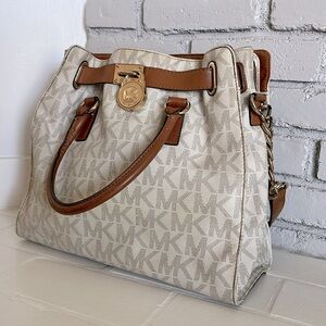 Michael Kors large tote. Brown and beige colors with gold chains and details.